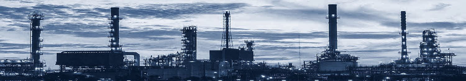 Oil and gas processing facility at dusk